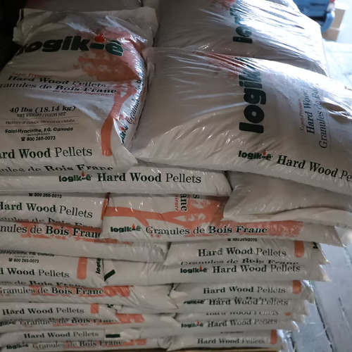 Stacks of white bags labeled 