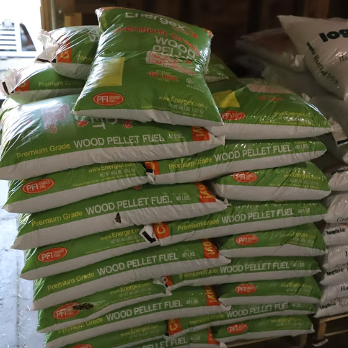 Stacks of green and white bags labeled 
